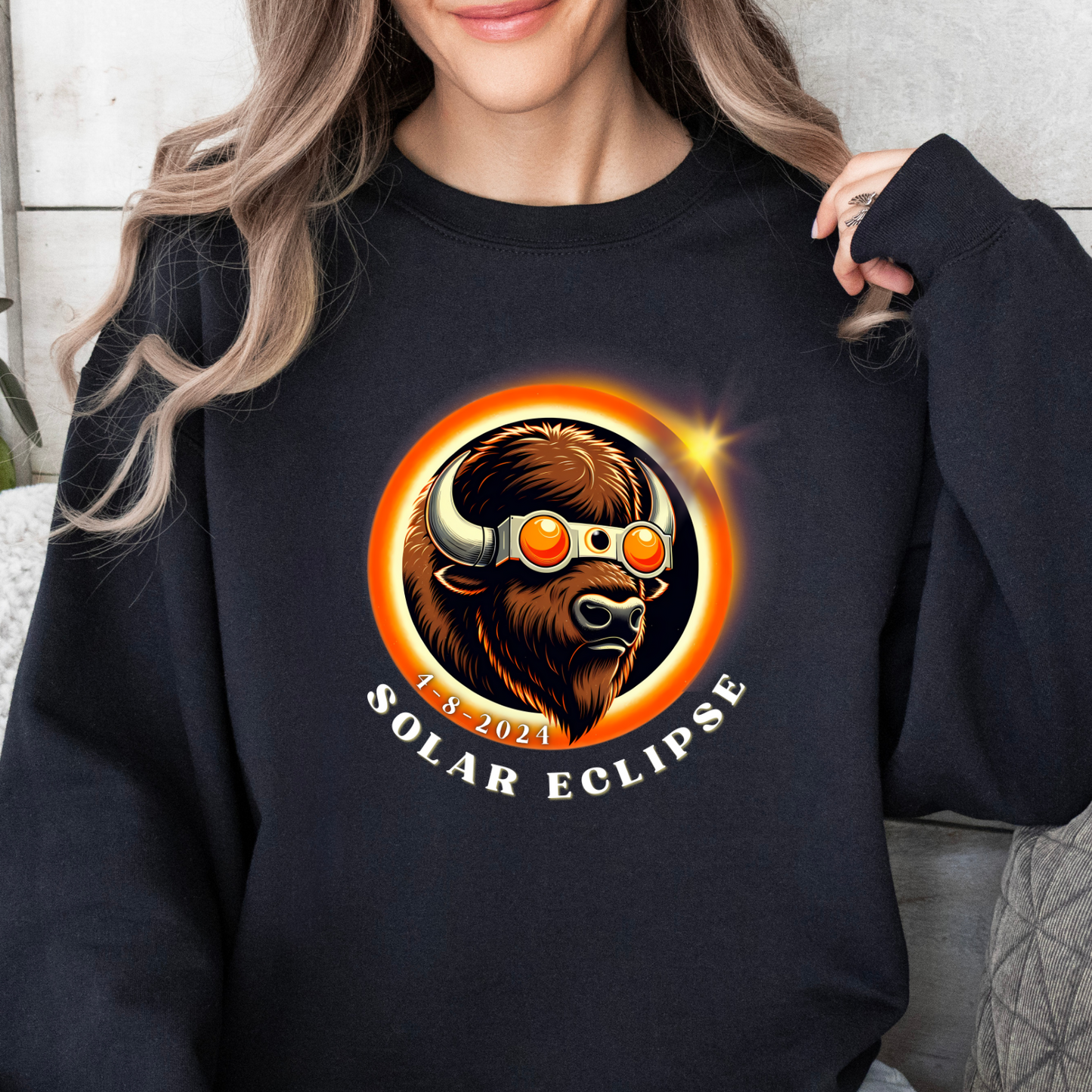 Rock your style with our American Buffalo Eclipse Sunglasses Sweatshirt! Catchy and bold, this sweatshirt features a trendy buffalo sporting eclipse glasses, perfect for celestial enthusiasts with a flair for fashion. Elevate your wardrobe with this unique piece and stay cozy in cosmic charm. Embrace the eclipse in style with this must-have sweatshirt