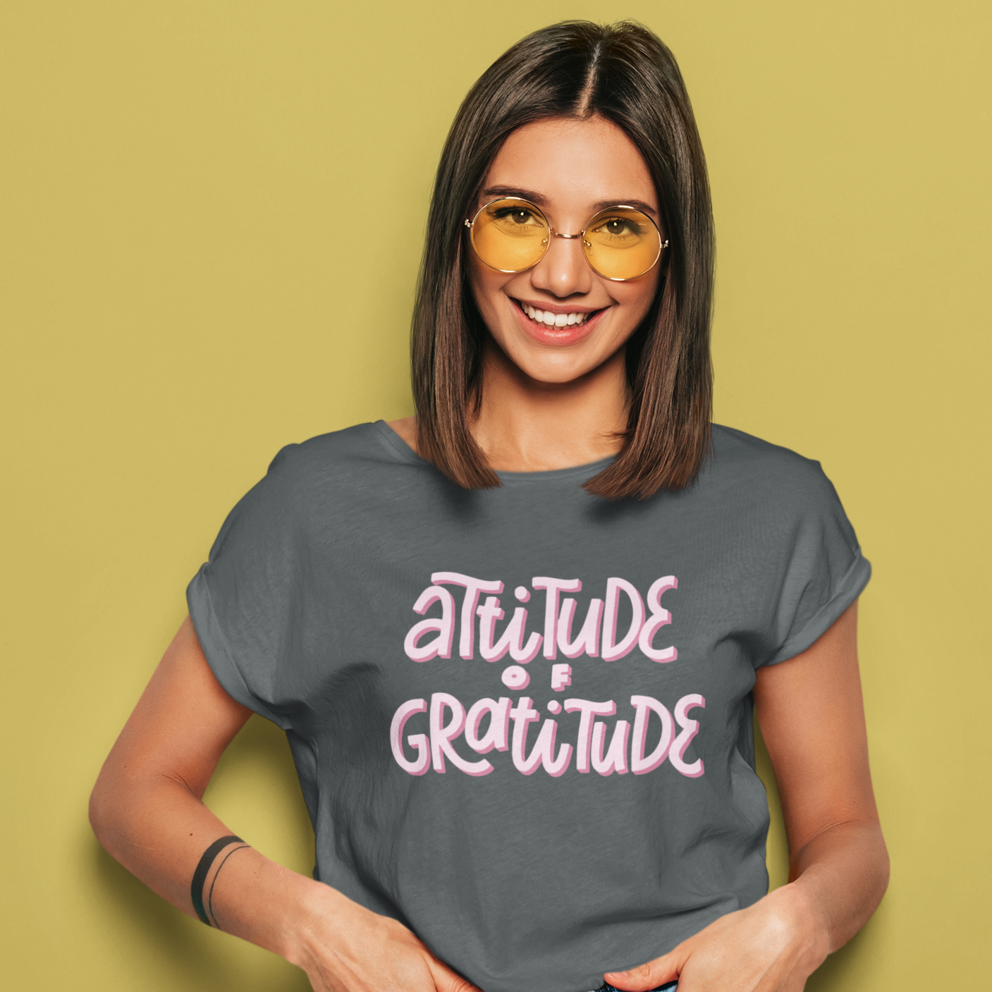 Graphic Unisex T Shirt that reads Attitude Of Gratitude and Canvas tee in the color charcoal