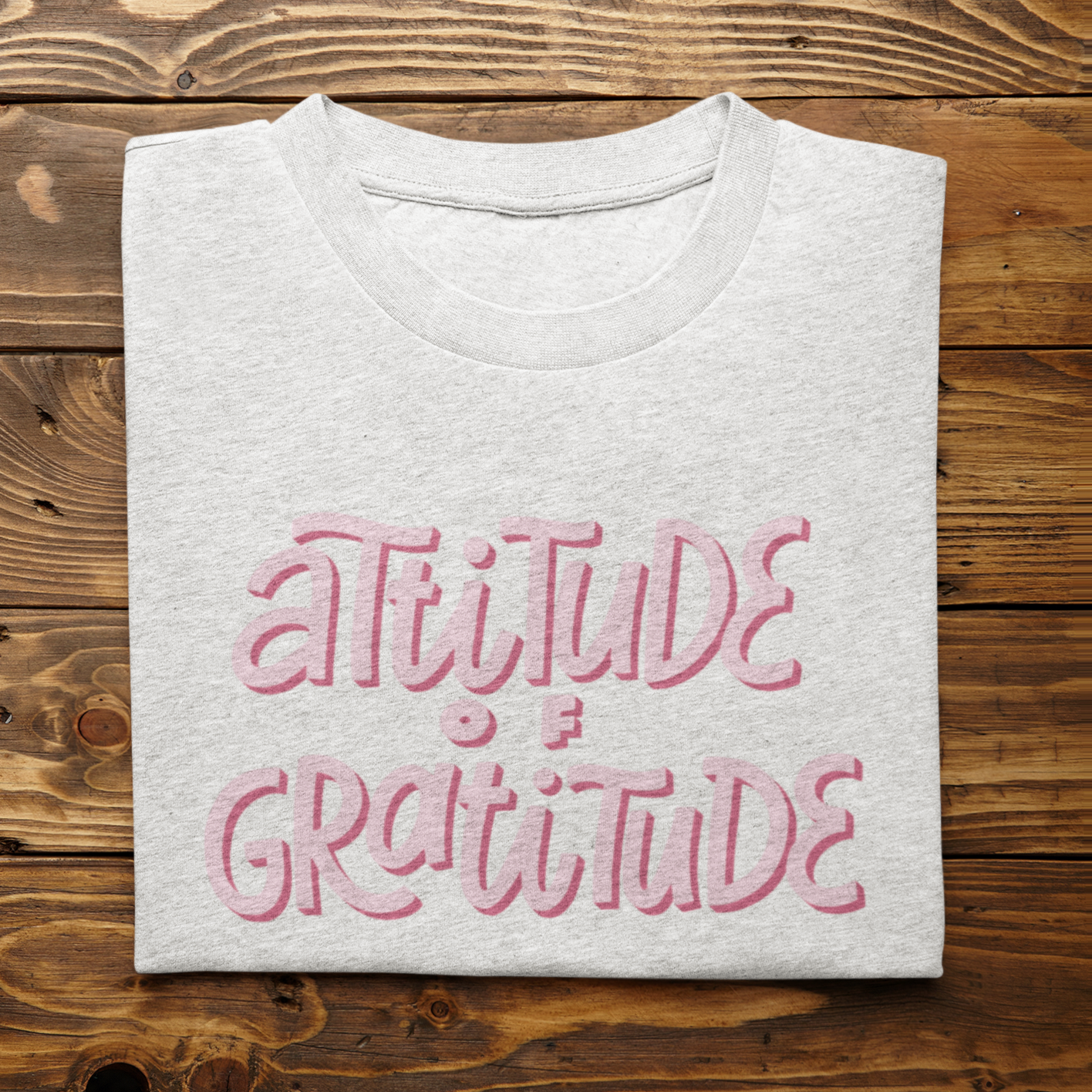 Graphic Unisex T Shirt that reads Attitude Of Gratitude and Canvas tee in the color white