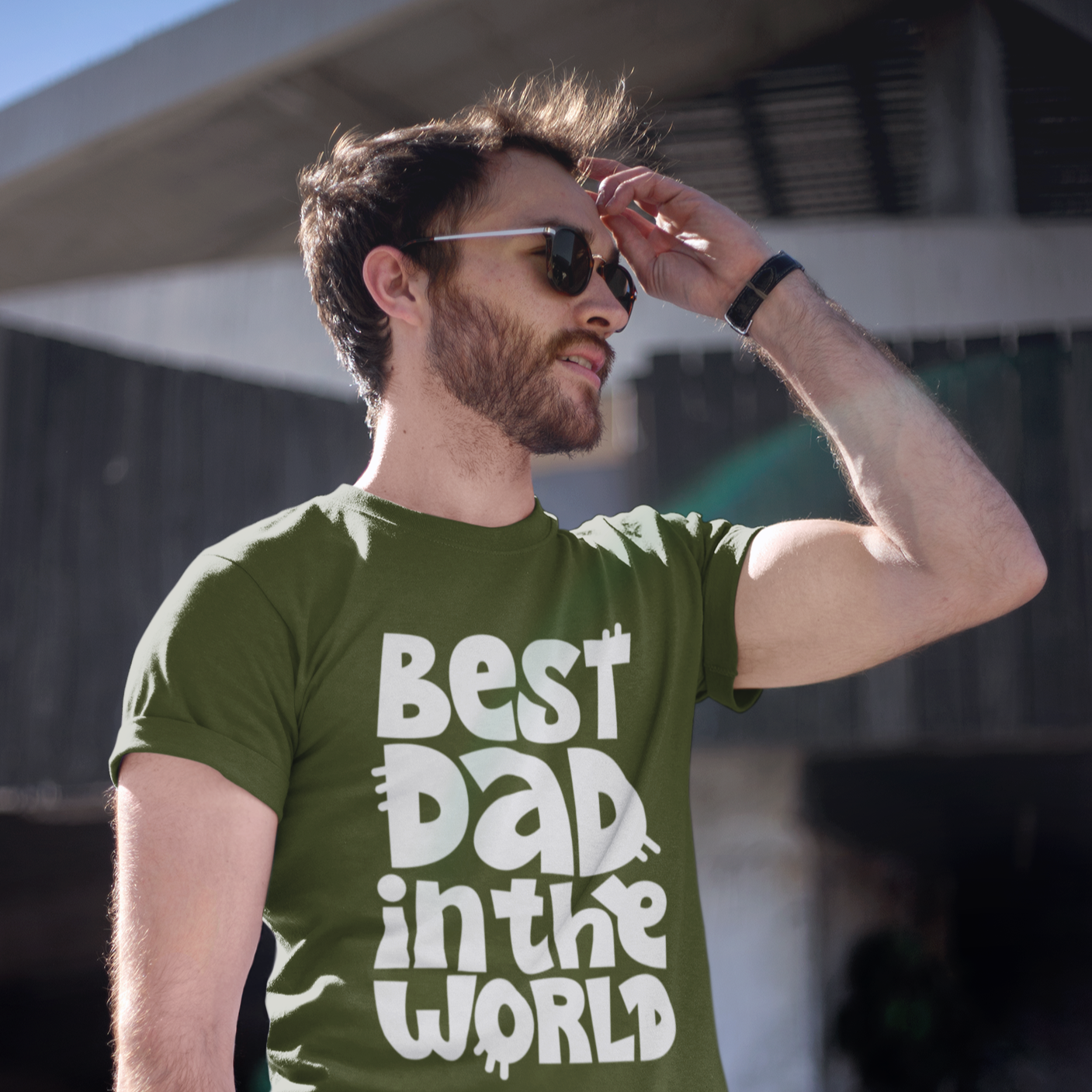 Graphic Unisex T Shirt that reads Best Dad In The World and Canvas tee in the color Military Green