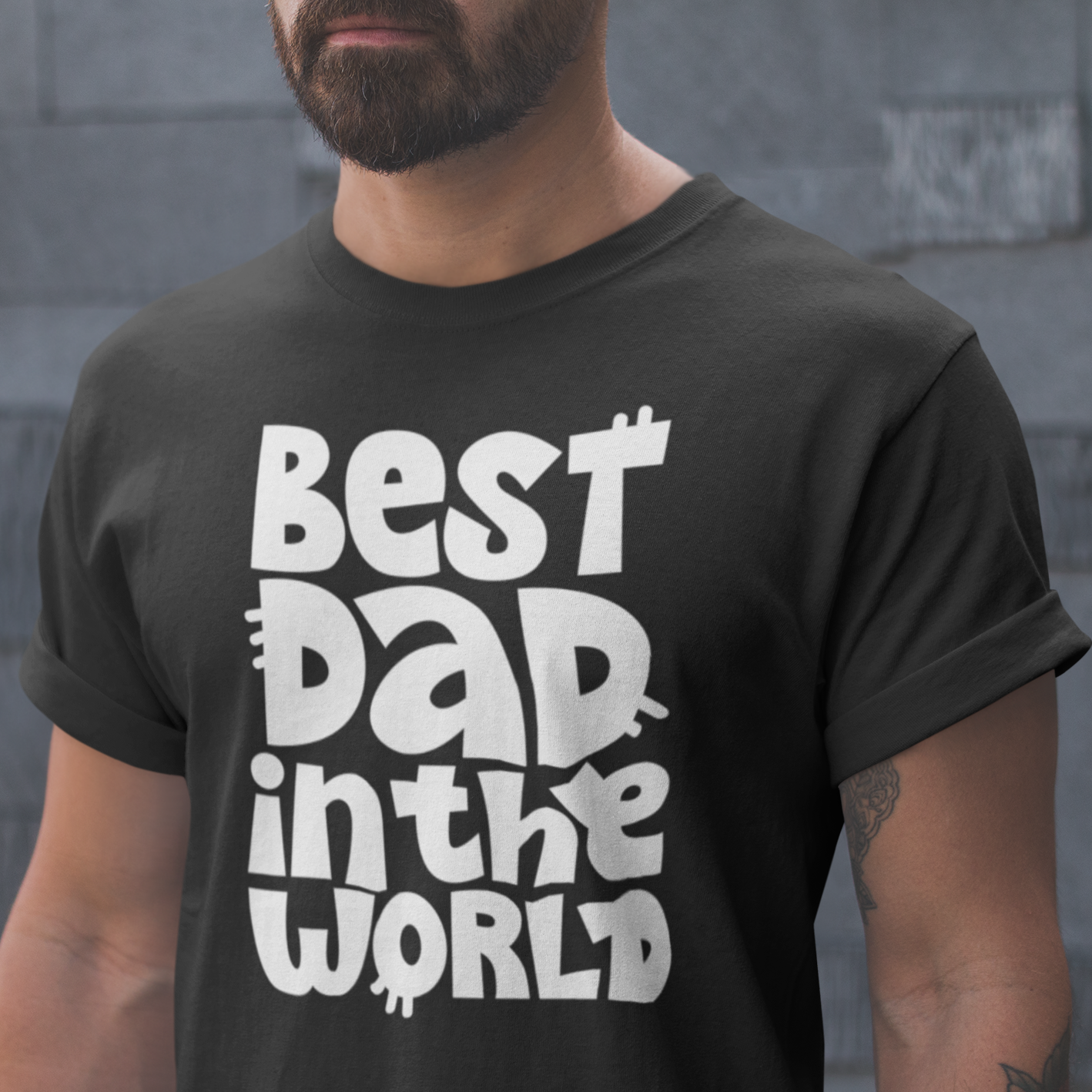 Graphic Unisex T Shirt that reads Best Dad In The World and Canvas tee in the color Black