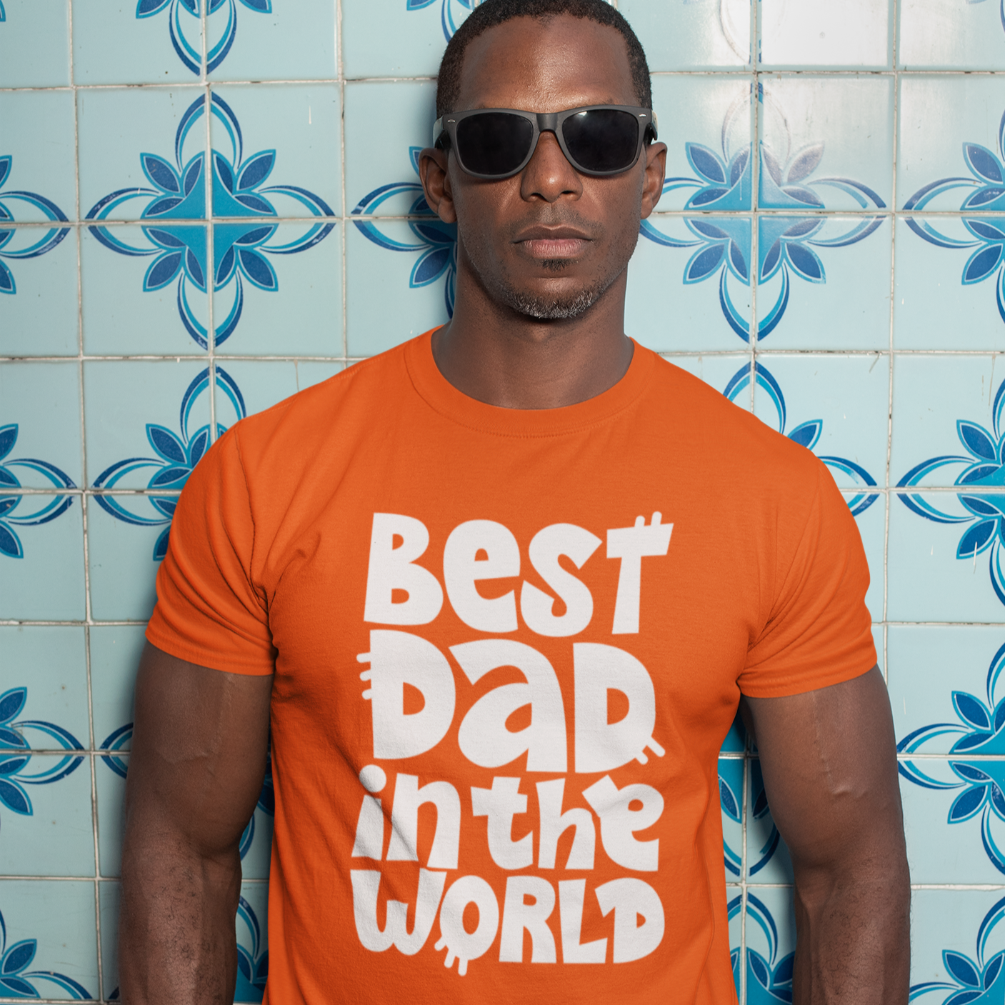 Graphic Unisex T Shirt that reads Best Dad In The World and Canvas tee in the color Orange