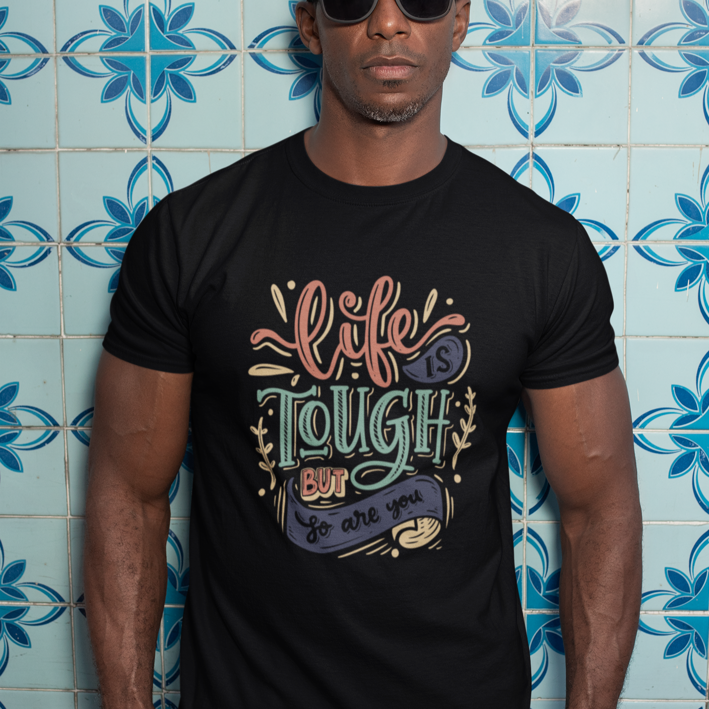 Graphic Unisex T Shirt that reads Life is Tough But So Are You and Canvas tee in the color Black