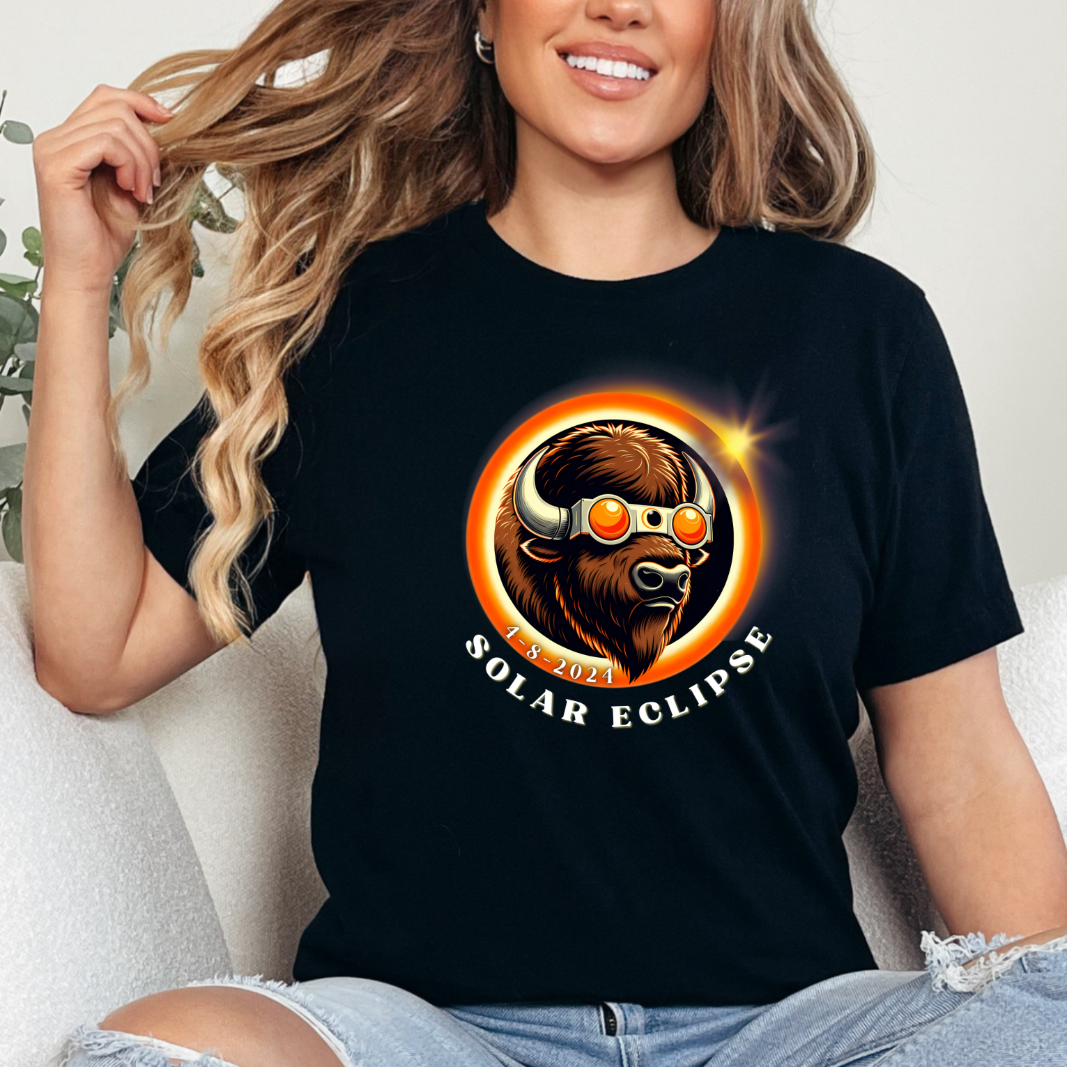 Graphic Unisex shirt that displays an American buffalo wearing Solar Eclipse sunglasses inside a solar eclipse Bella and Canvas shirt in the color black