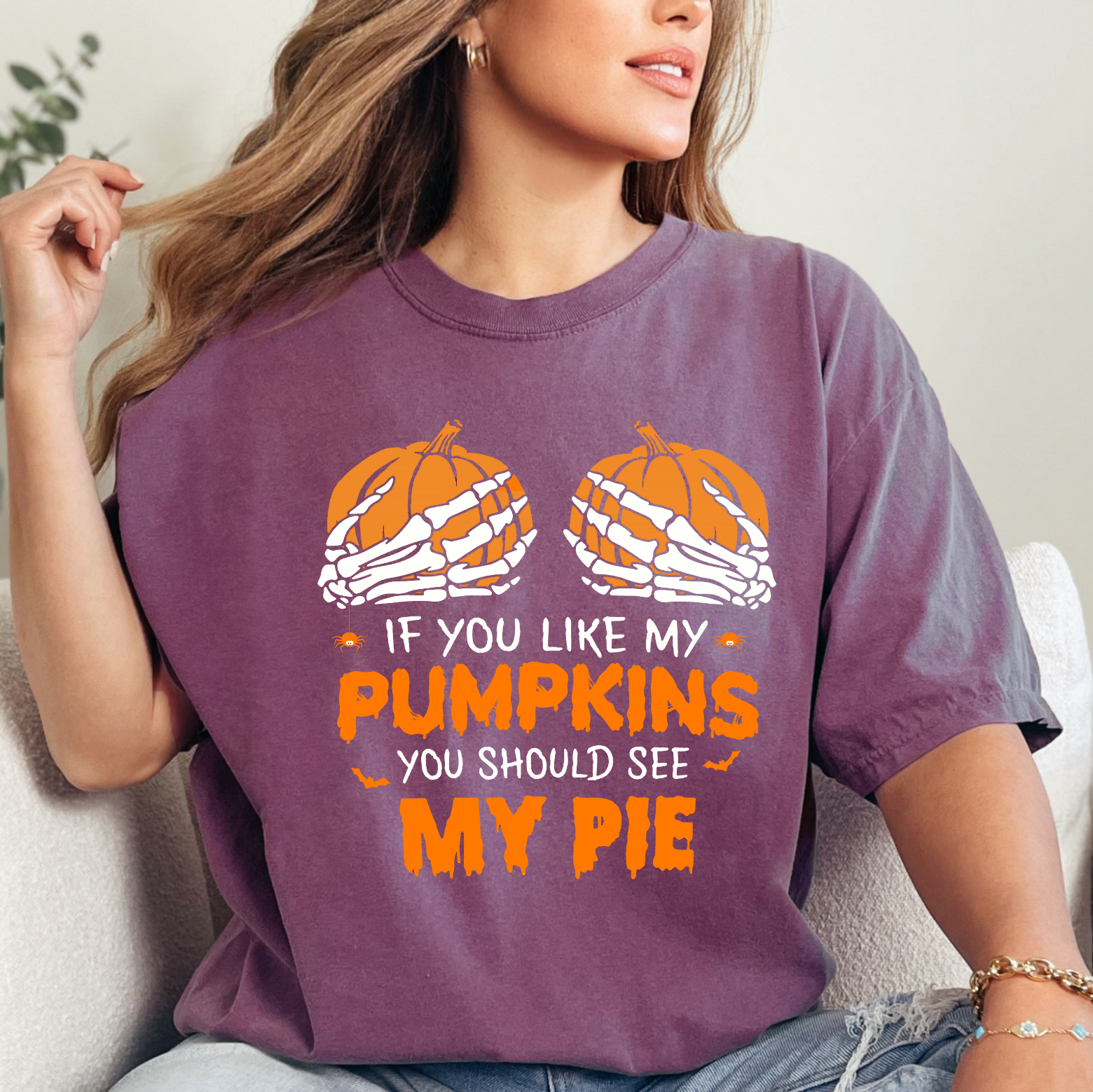 Add some cheeky fun to your fall wardrobe with the 'If You Like My Pumpkins You Should See My Pie' T-shirt! Perfect for Halloween and Thanksgiving, this playful tee is a must-have for those who love sarcastic humor and festive vibes.