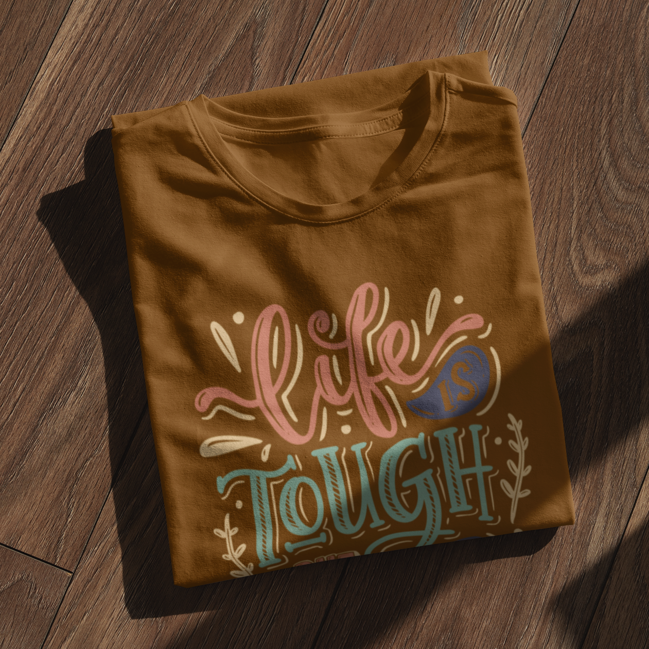 Graphic Unisex T Shirt that reads Life is Tough But So Are You and Canvas tee in the color Chocolate Brown