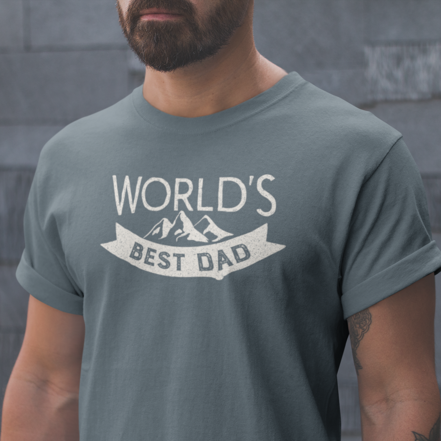 Graphic Unisex T Shirt that reads World&#39;s Best Dad and Canvas tee in the color Charcoal Grey