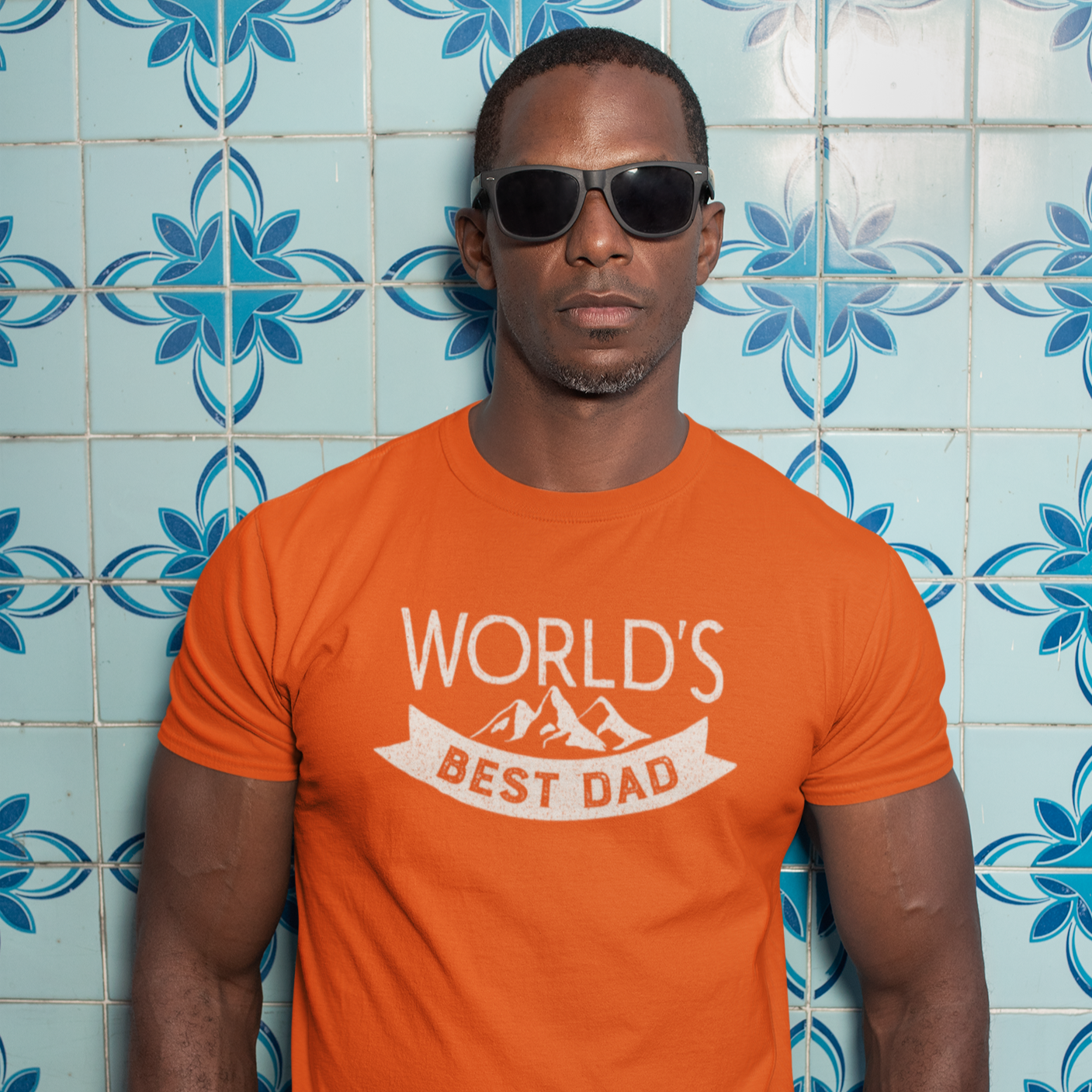 Graphic Unisex T Shirt that reads World&#39;s Best Dad and Canvas tee in the color orange