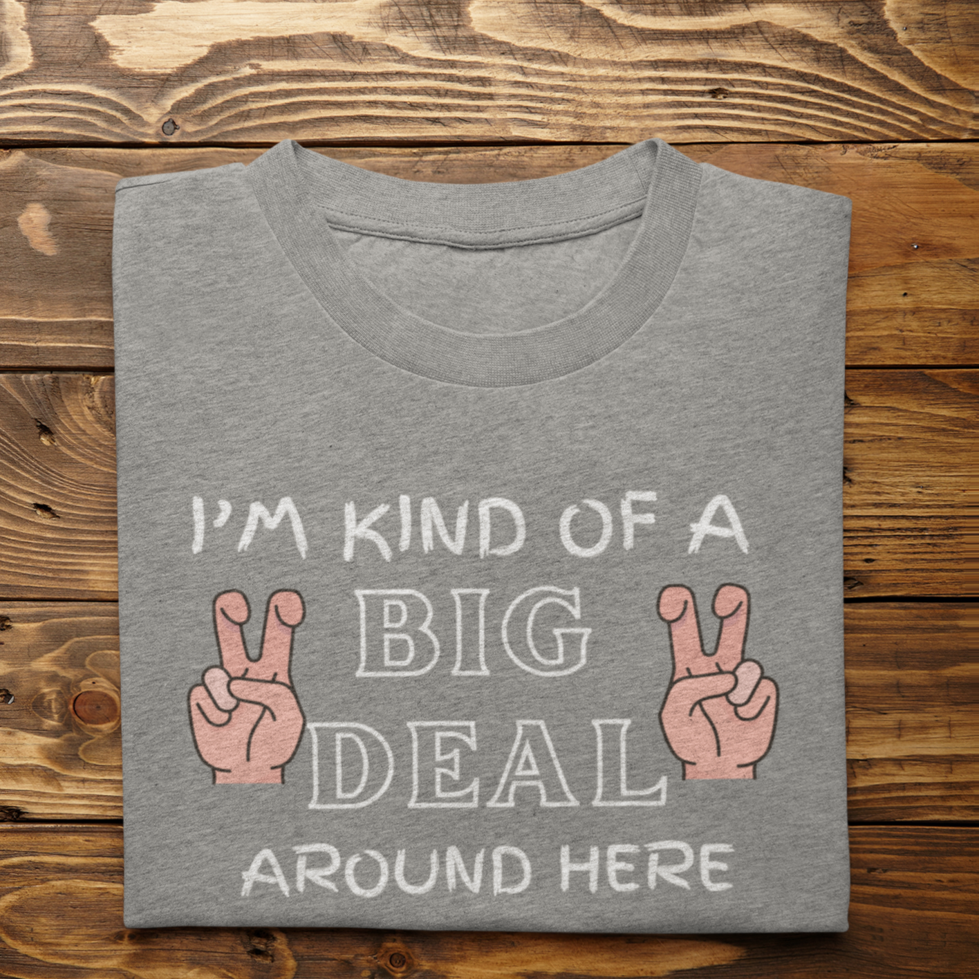 Graphic Unisex T Shirt that reads I&#39;m Kind Of A Big Deal Around Here and Canvas tee in the color charcoal grey